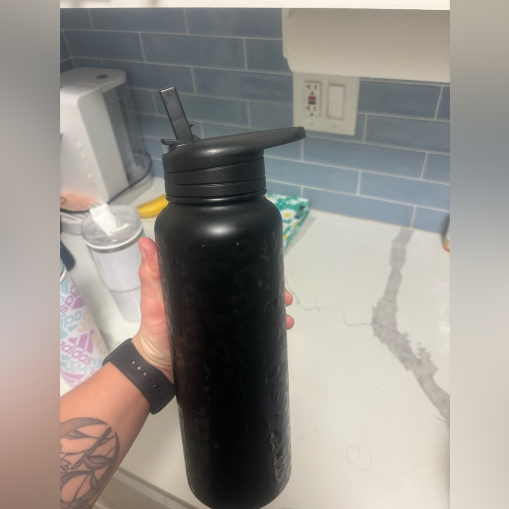 Cheetah print water bottle with straw